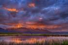 Wetlands pond reflects the Mission Mountains at sunset at Ninepipe NWR near Ronan, Montana, USA. Art Print